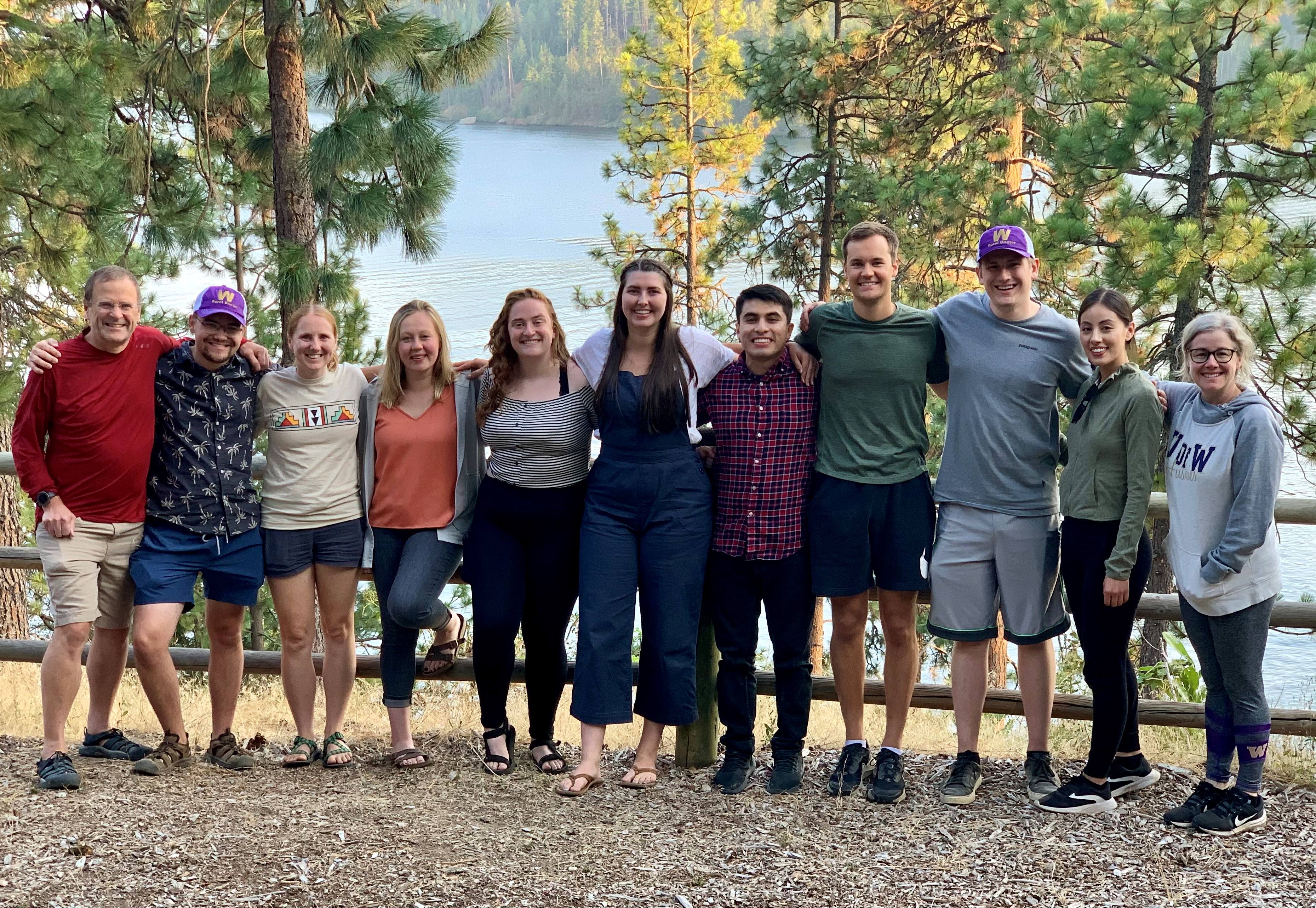 WA TRUST students posing for a photo in front of lake 