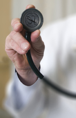 A hand holding a stethoscope