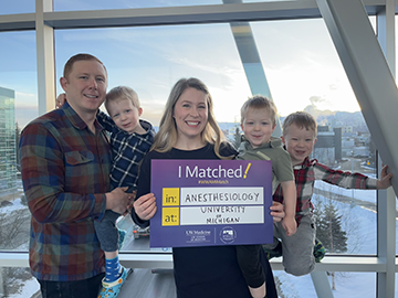 Grace champion with her husband, and three sons.