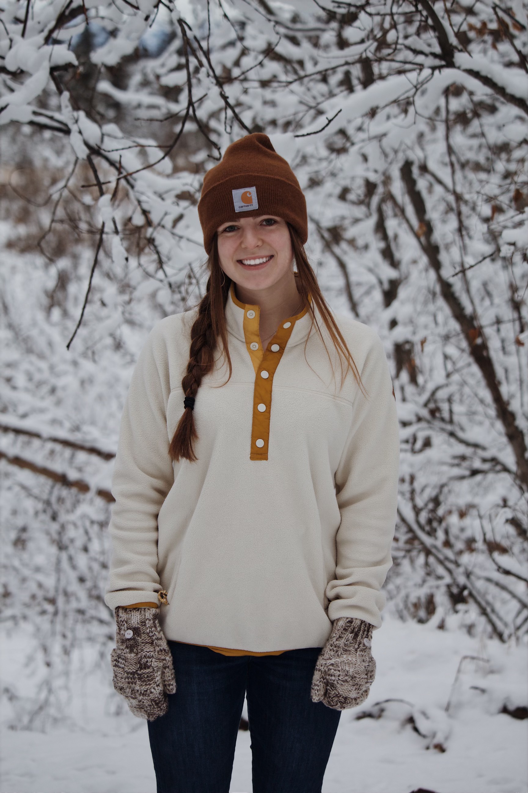 Abigail Crawford dressed in winter clothes standing in the snow