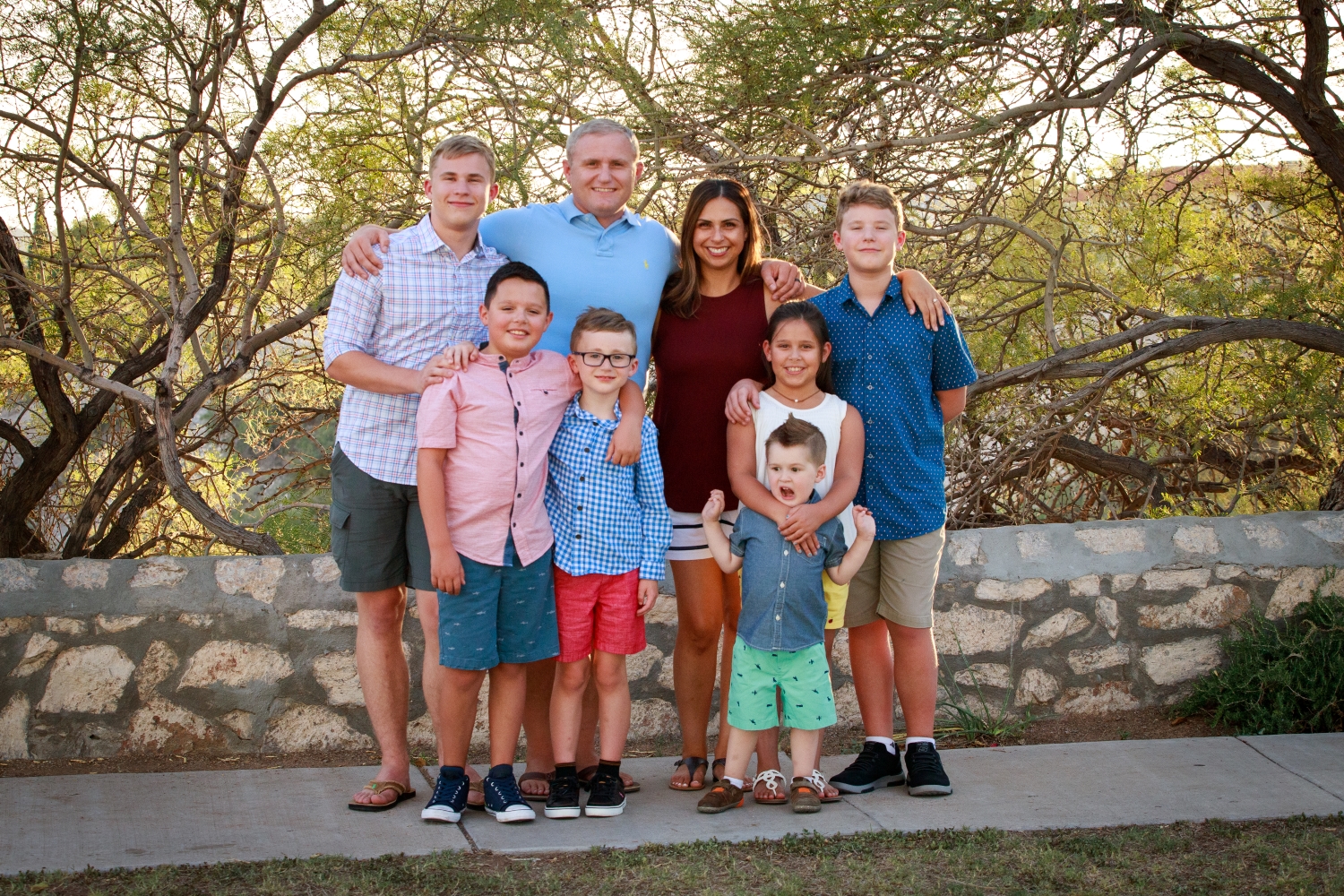 The Talley family posing together outdoors