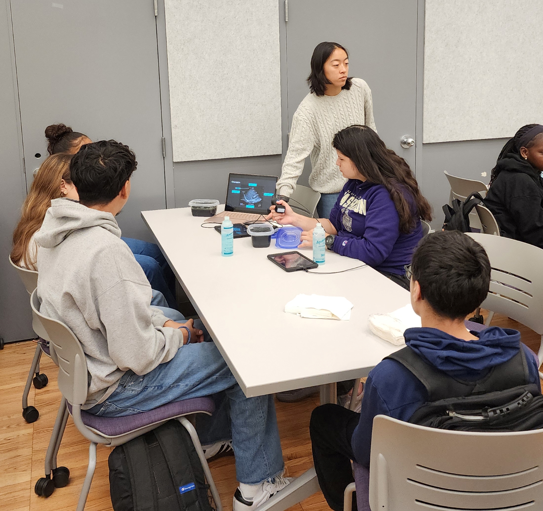 Medical students Jessie Gong and Sabina Yafunyaeva of the Ultrasound Interest Group lead high school students in an activity