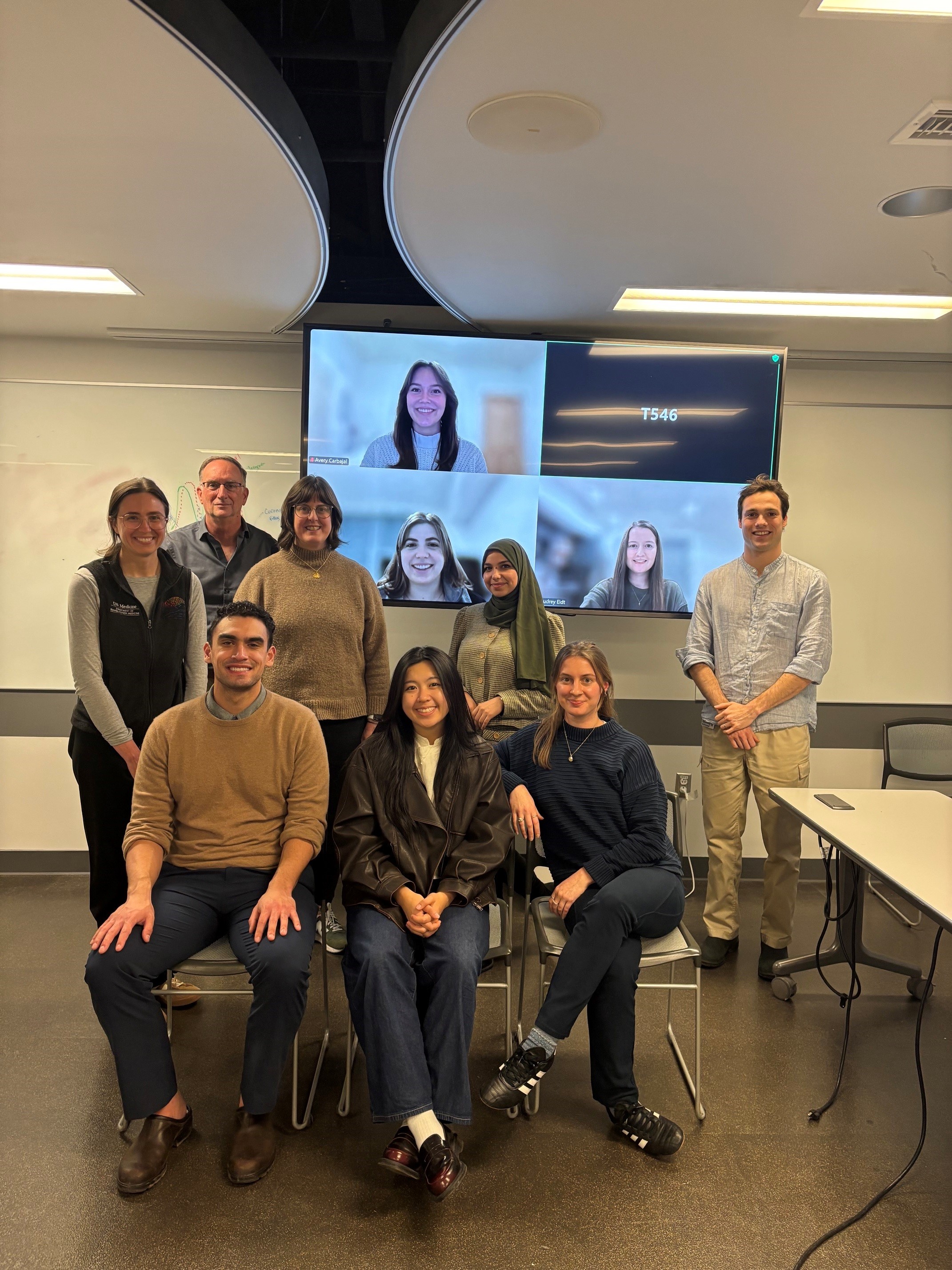 A class photo of the Humanities and the Arts Pathways students with their instructors. Three students appear on Zoom in the background.