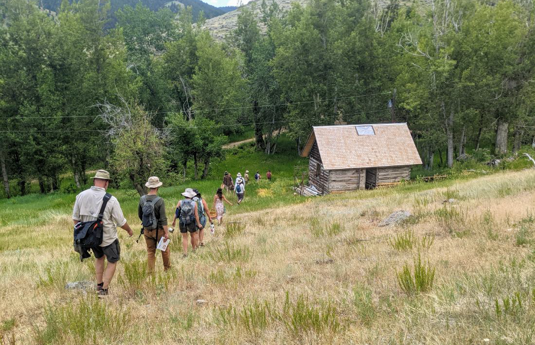 A group of students hike through the Pony Creek property