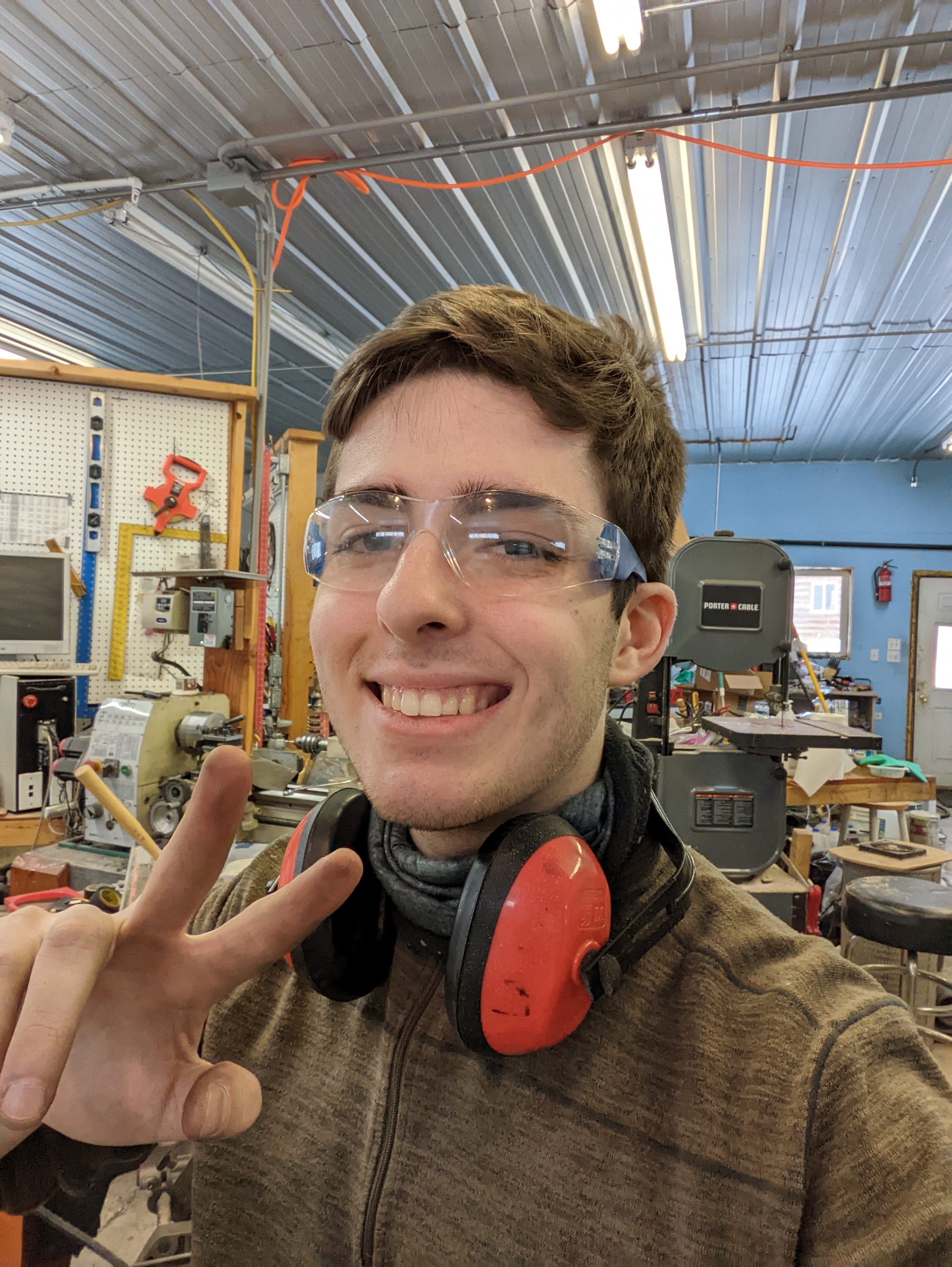 Joren Bowling wears protective glasses and headphones