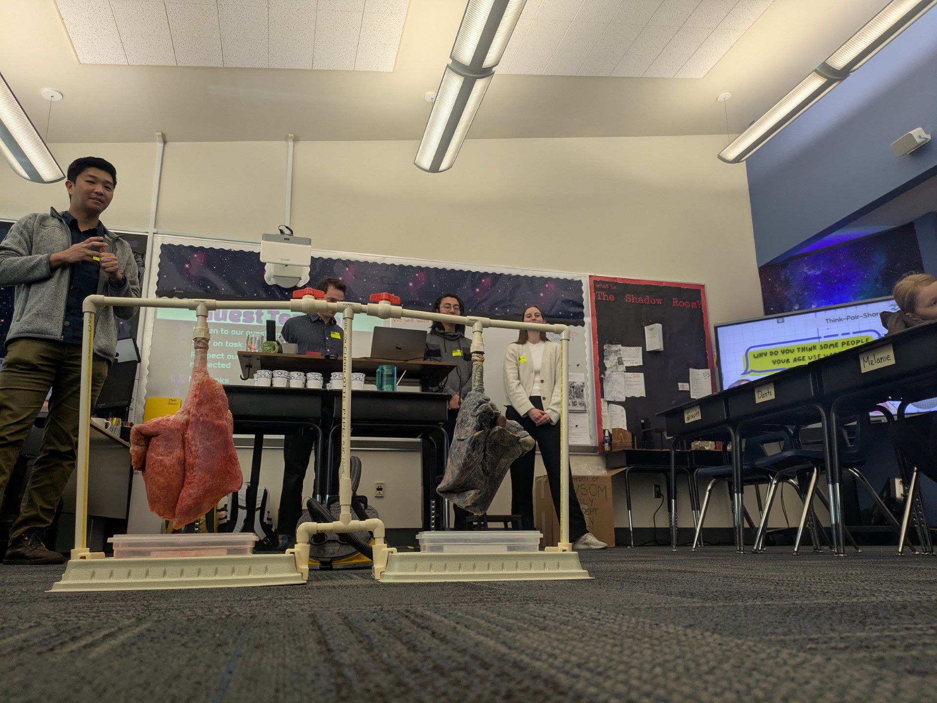 Medical students show fifth graders a model of the lungs to illustrate the health impacts of nicotine use