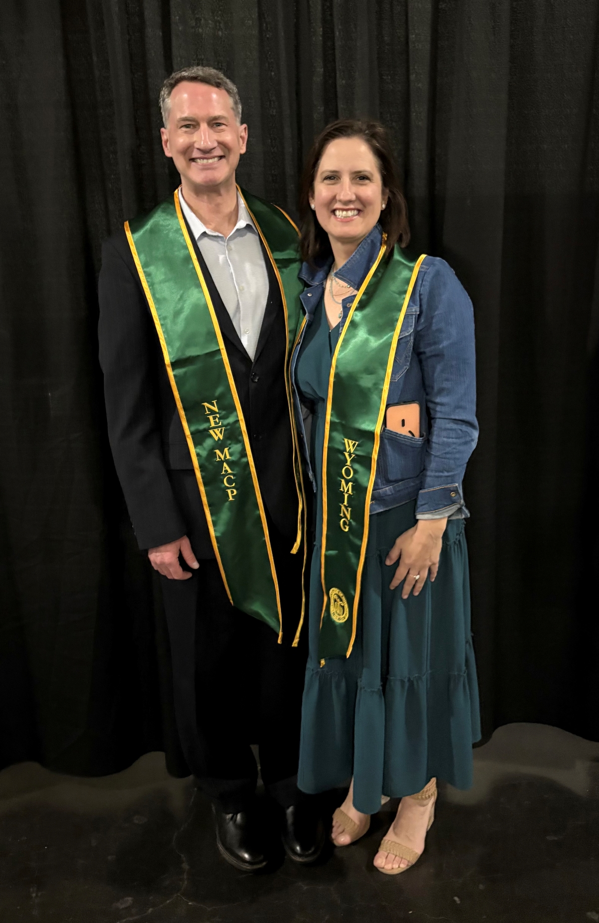 Rob monger poses with an anonymous woman in his stole indicating Mastership status with the ACP