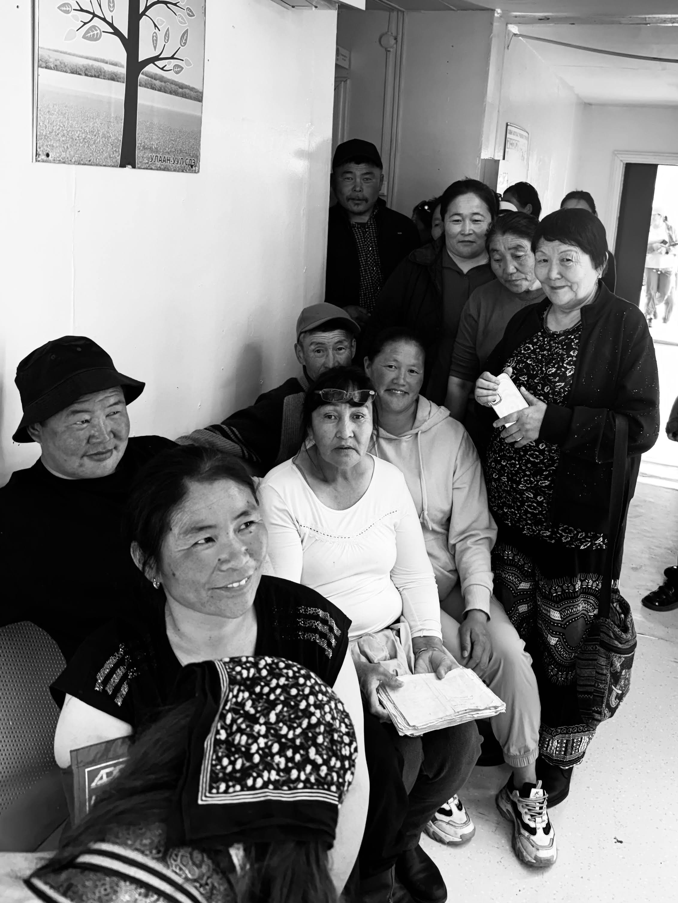 A black and white photo of a group of people